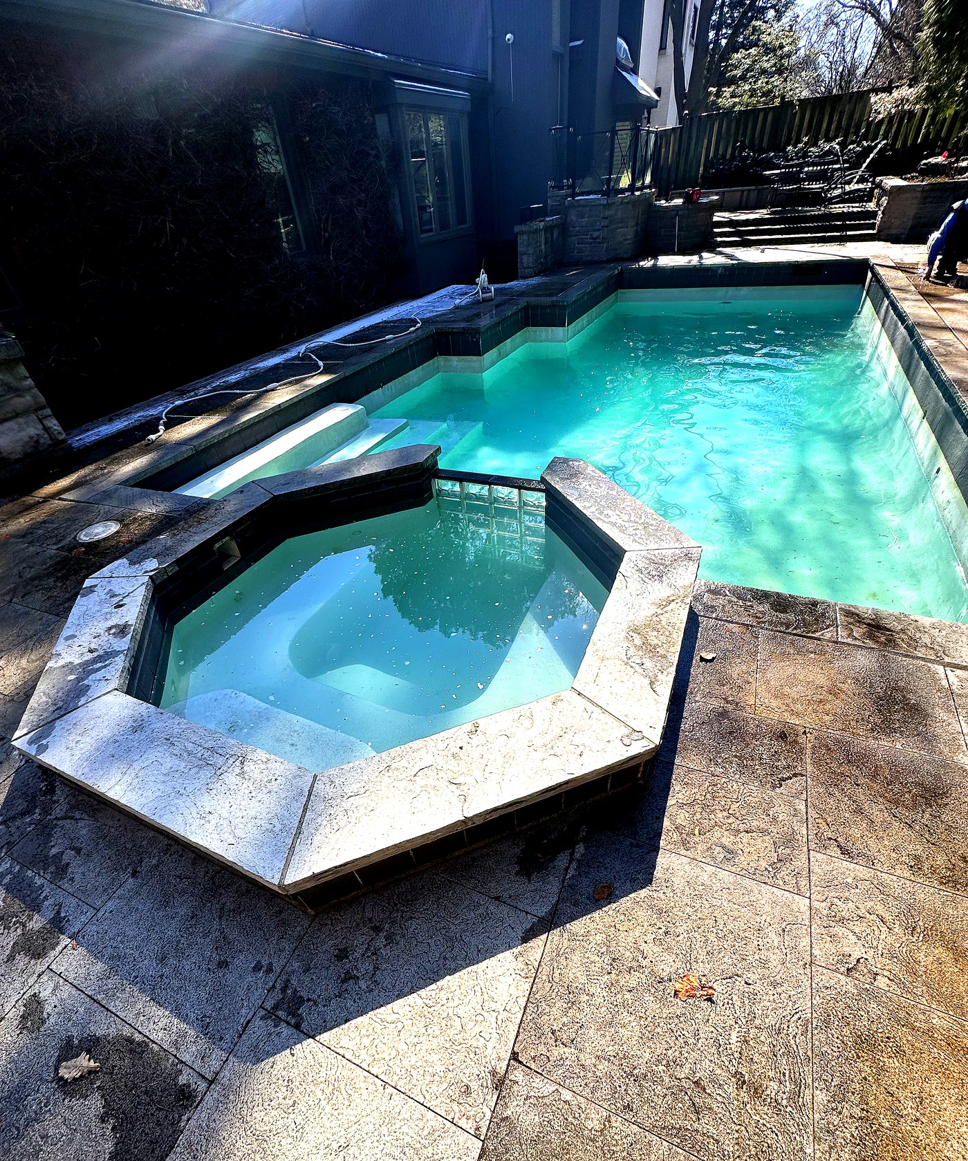 Octagonal spa after cleaning — clear blue water