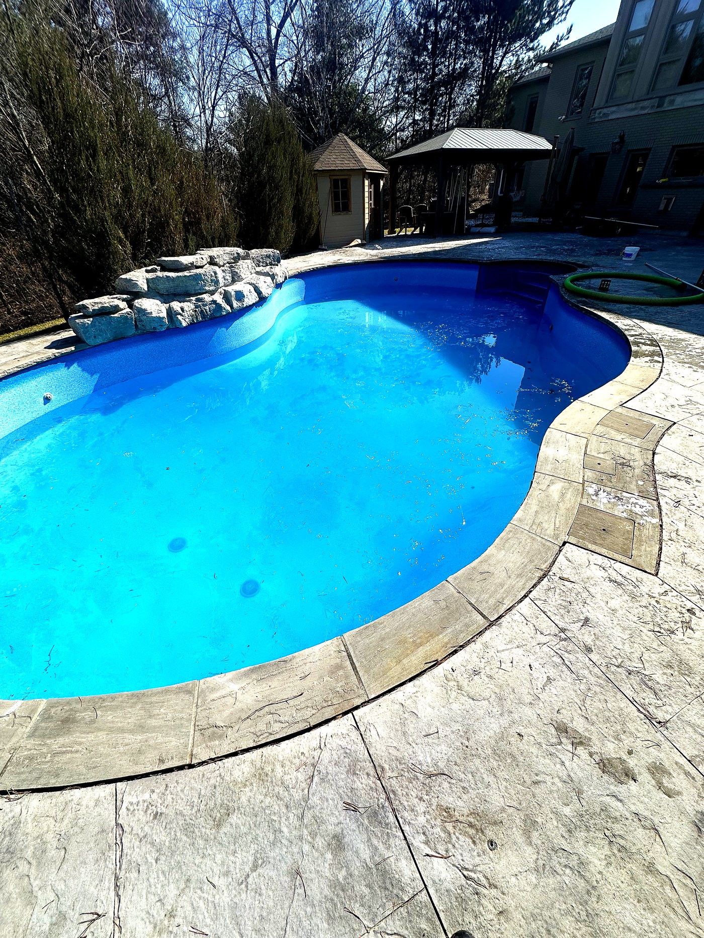 Kidney-shaped pool after opening