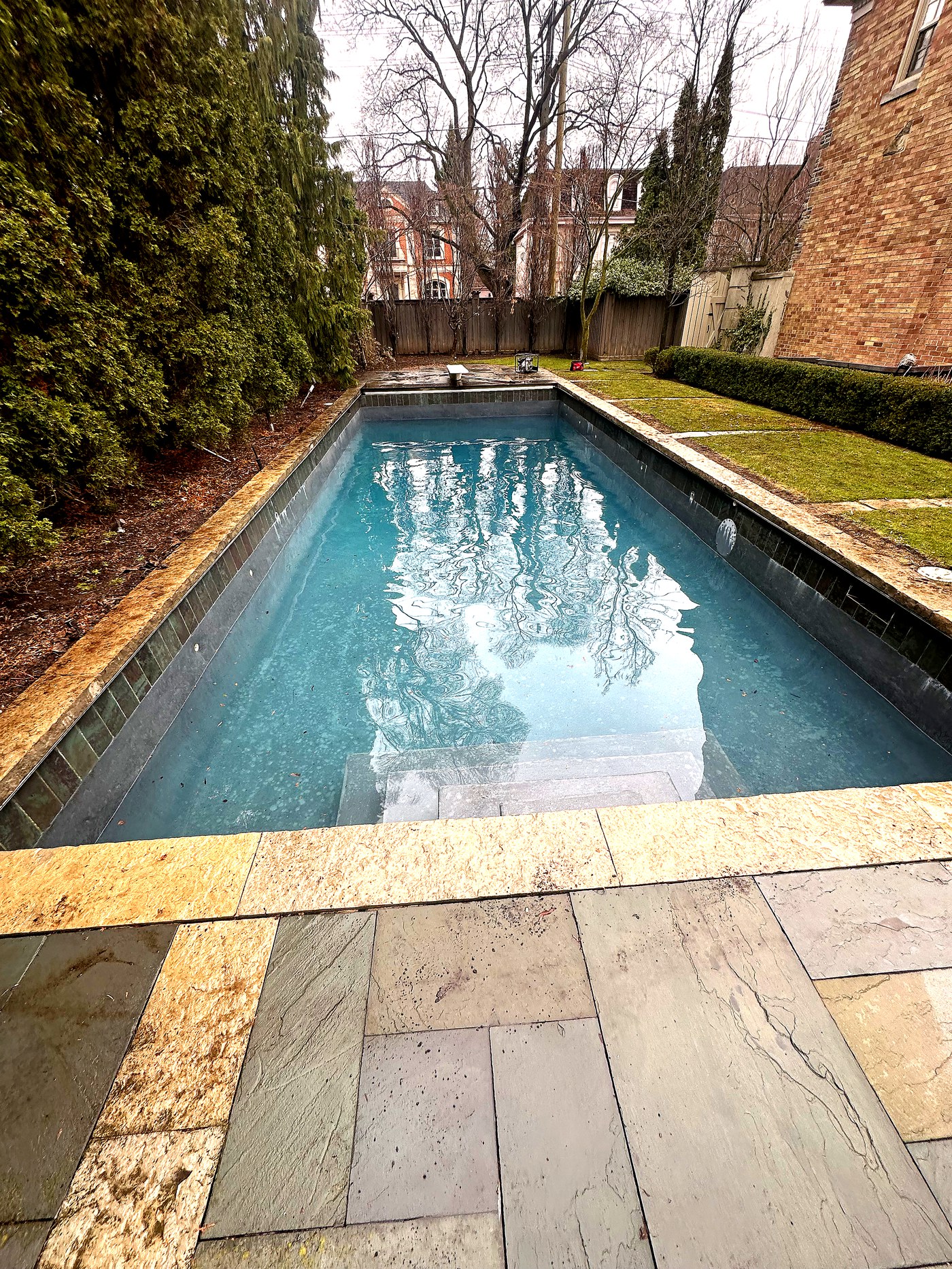 Rectangular pool with stone coping after opening